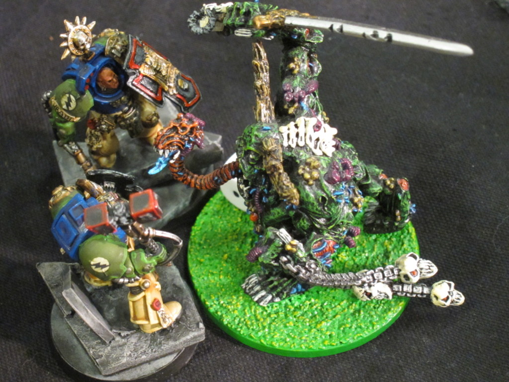 A Great Unclean One exchanges mighty blows with a Terminator Sergeant.