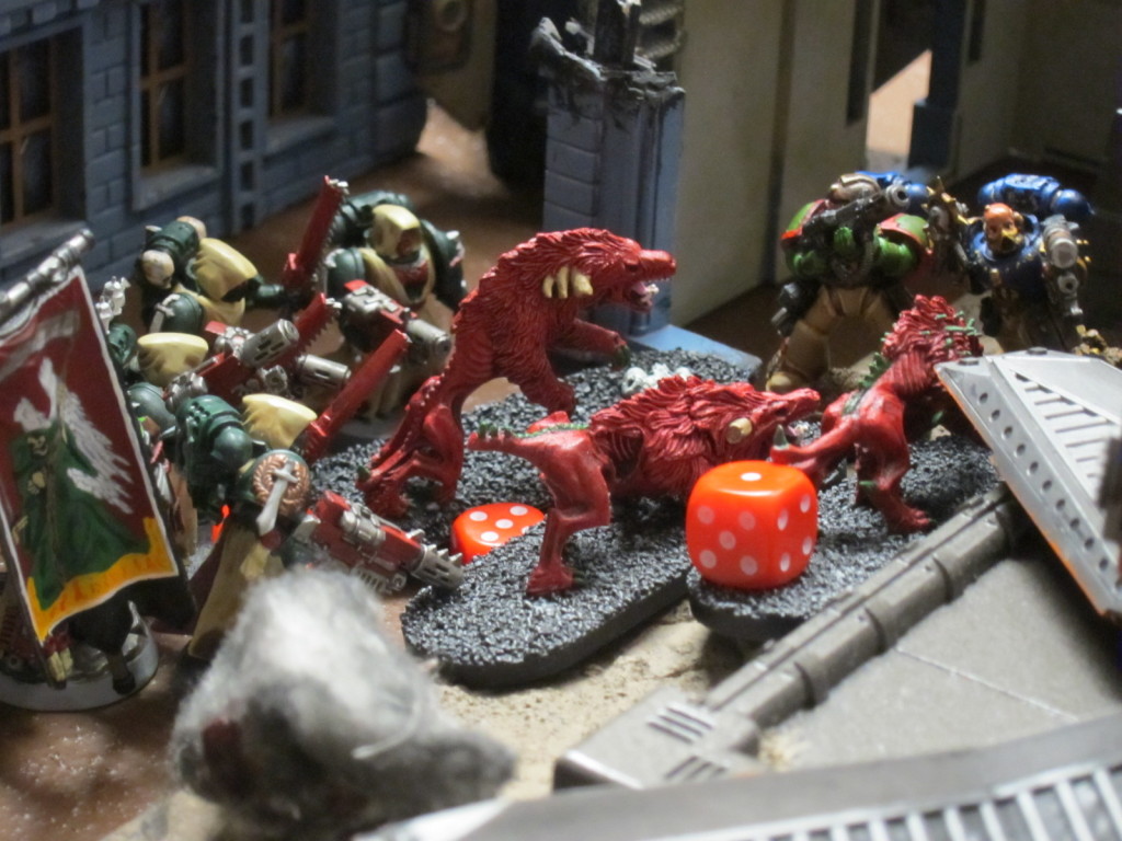 Kingbreakers Squad Harbinger and Dark Angels Tacticals work to purge the alleyways and rubble surrounding the Hab Blocks.