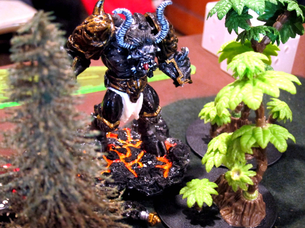 A molten daemon lurks in the bushes.