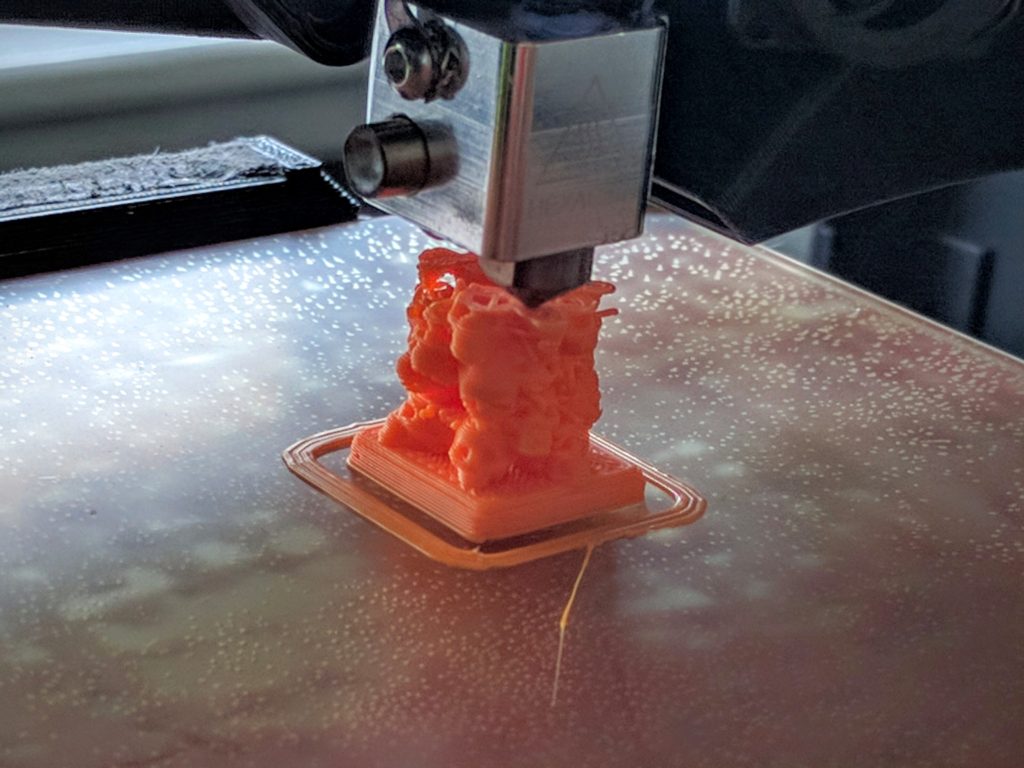 An exemplar of one of the world's most advanced technologies! ... being used here to print a literal tower of skulls for next month's boardgaming ...