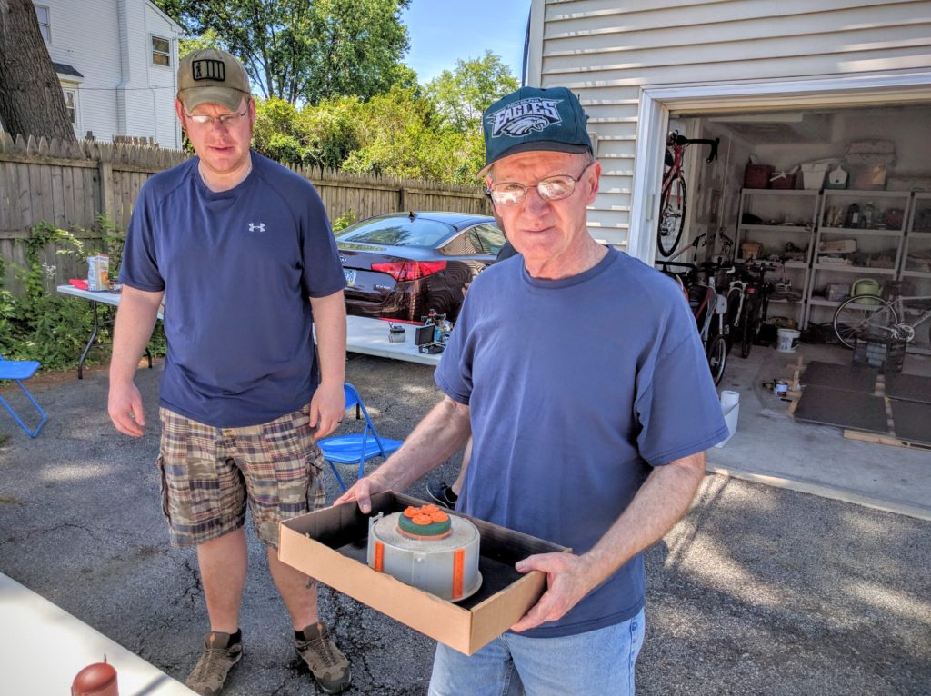 Tom gets ready to prime the reservoir tank to start the day.