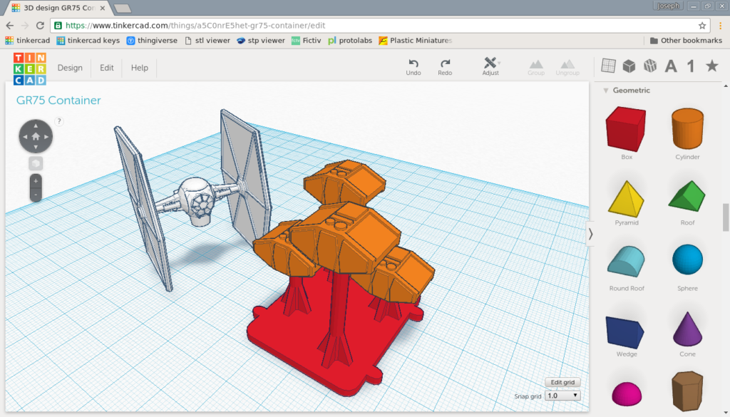 Final design mockup of a cluster of cargo pods; prints are made as one base piece (red) and a bunch of pods (orange) that fit onto the pegs.